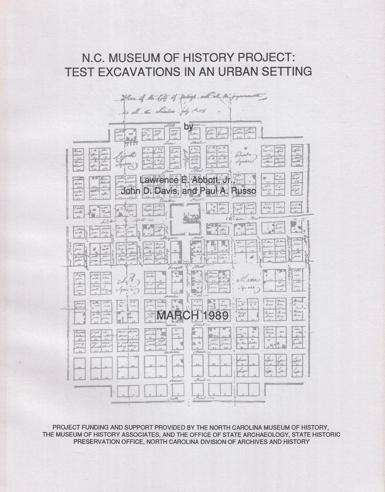 Item #5595 N.C. MUSEUM OF HISTORY PROJECT: TEST EXCAVATIONS IN AN URBAN SETTING. Lawrence E. Abbott, John D. Davis, Jr., Paul A. Russo.